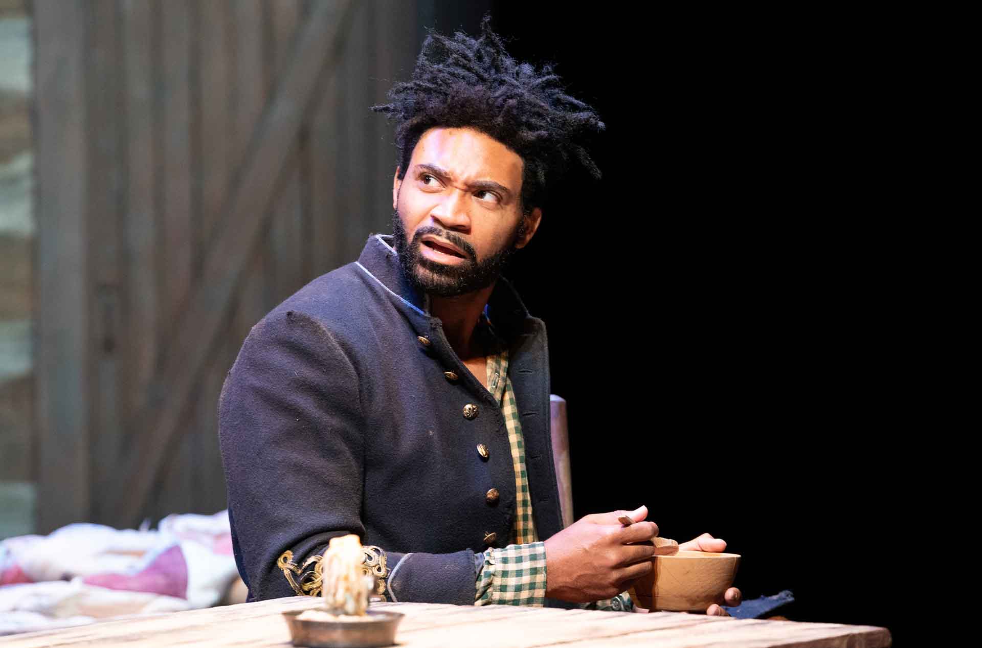 Person sitting looking at something off camera.