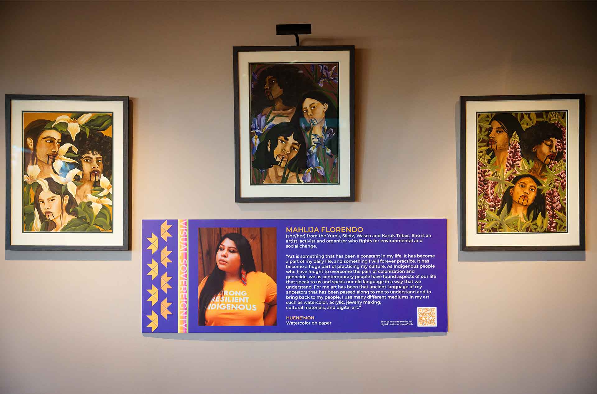 Three paintings above a poster with the artists information.