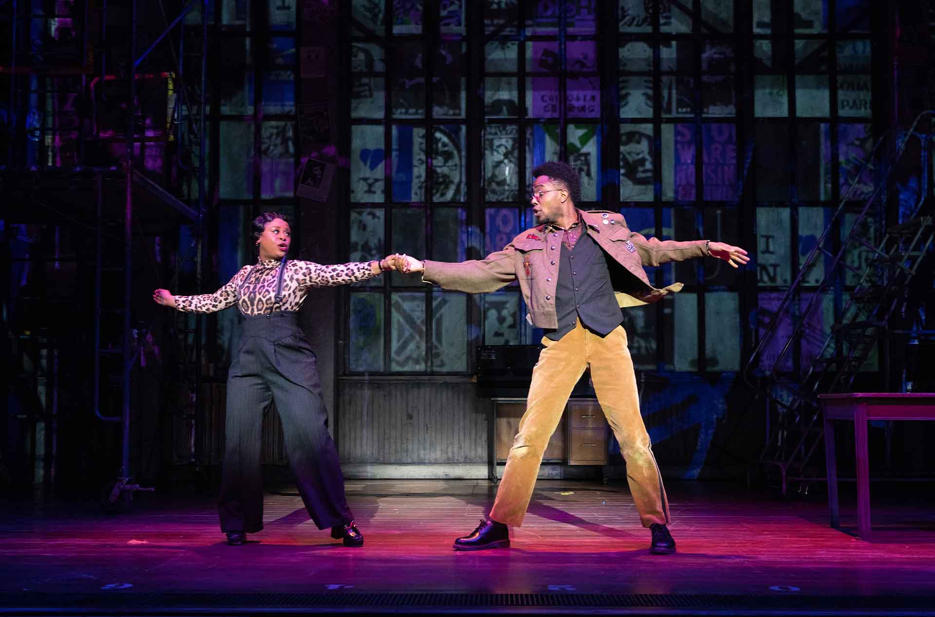 Two people holding hands and dancing.