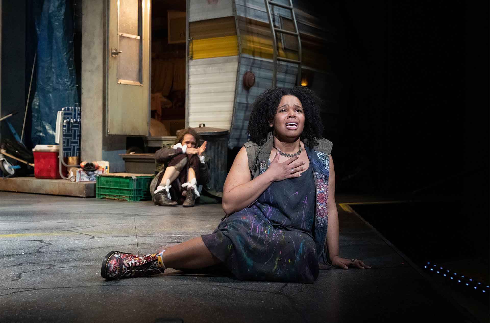 Juliet sitting looking into the distance.