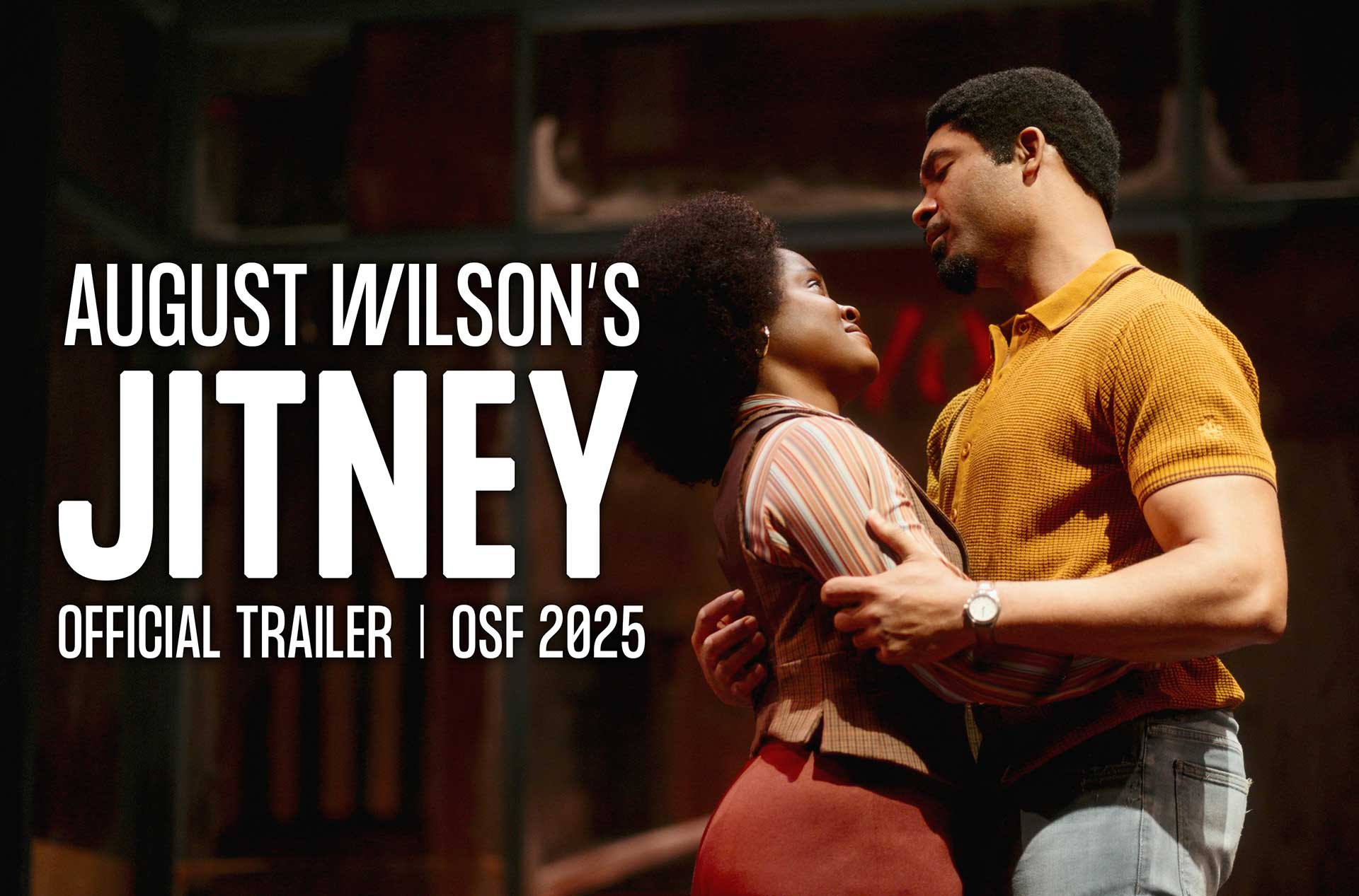 Two actors embrace and gaze into each other's eyes on stage, dressed in 1970s-style clothing. Large white text reads, "August Wilson’s Jitney – Official Trailer | OSF 2025."