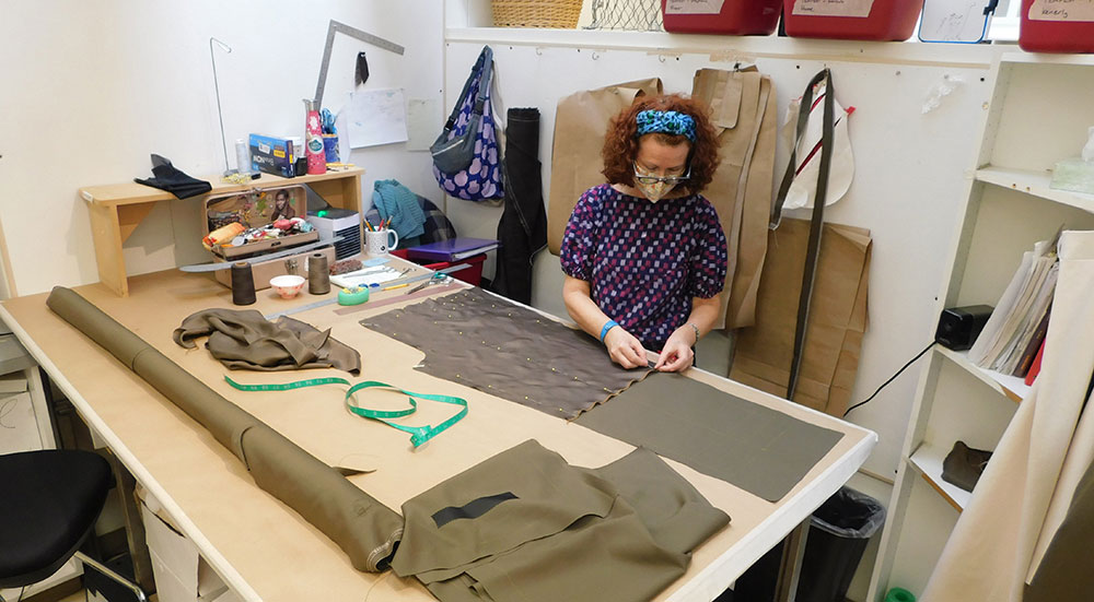 Lead Costumer Stephanie Cooper at work